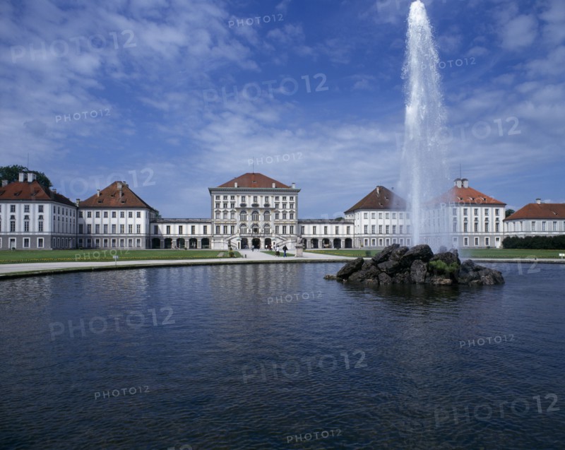 GERMANY, BAVARIA , Munich, Nymphenberg Palace. Ornamental lake with rock fountain and tall water spout
