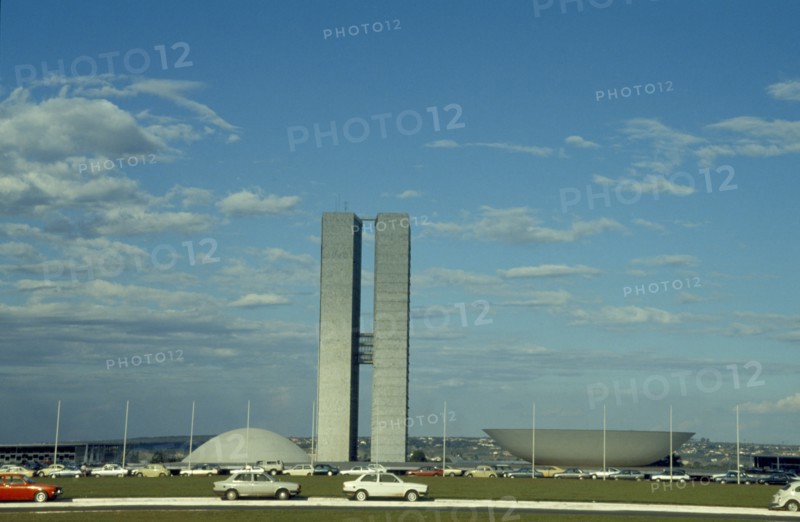 BRAZIL, Federal District, Brasilia, Palace of National Congress buildings seen over road in the foreground