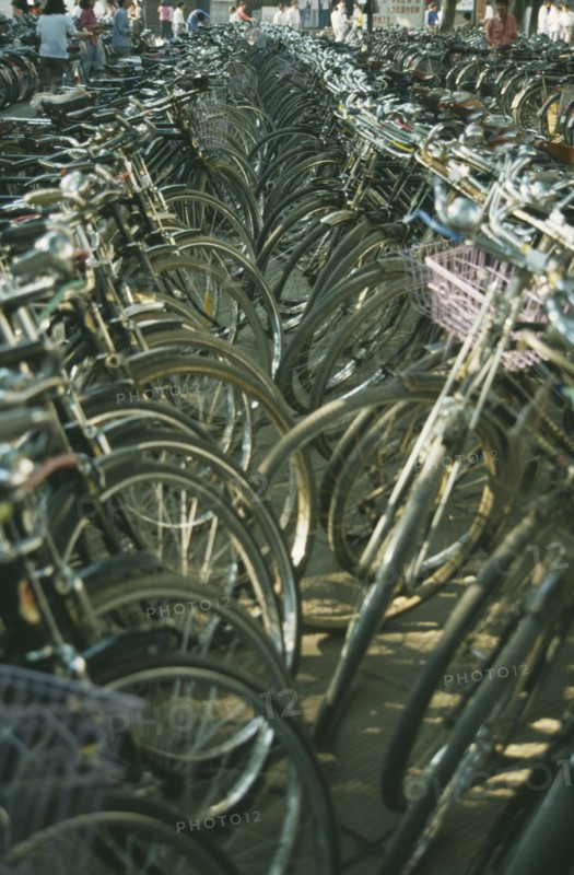 CHINA, Suzhou, Bicycle Park with view along rows of bicycles