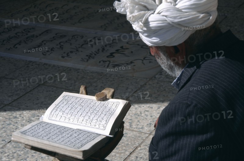 IRAN,   , Yazd, Man reading Koran