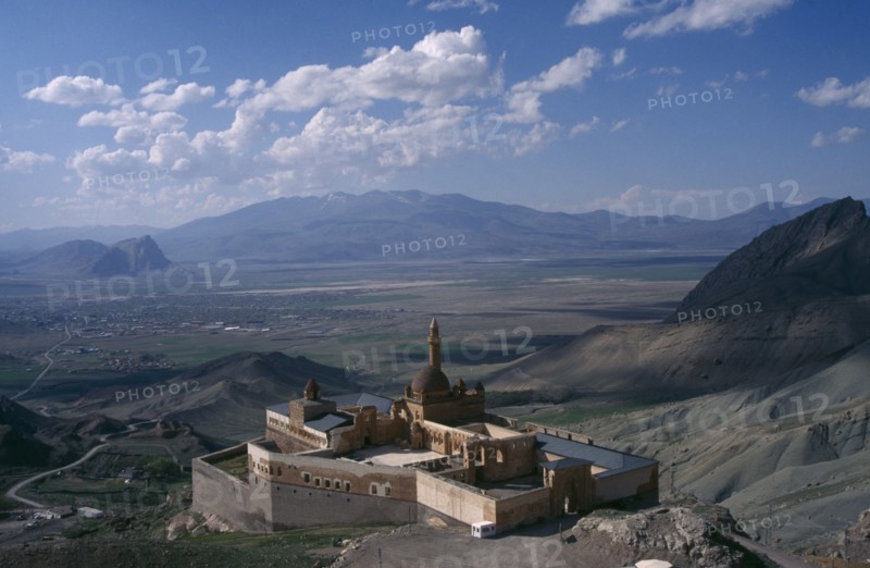 TURKEY, Dogubeyazit, Ishak Pasha Palace. View over hillside palace toward valley and mountains in the distance