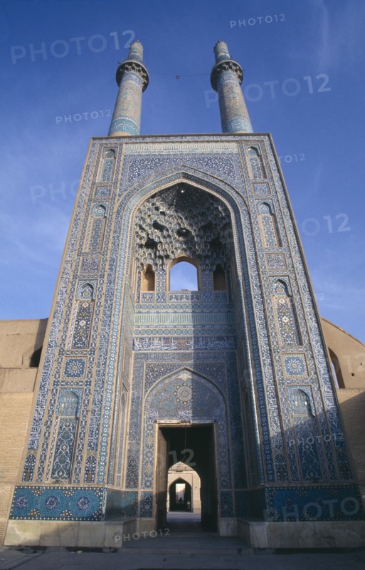 IRAN, Yazd, Friday mosque or Masjed e Jame mosque. Ornate entrance archway and twin towers
