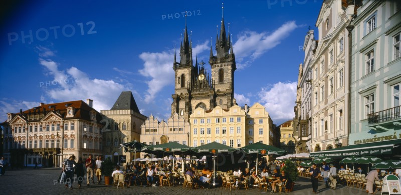 CZECH REPUBLIC, Stredocesky, Prague, View across Old Town Square toward Tyn Church with busy pavement cafes in the foreground.