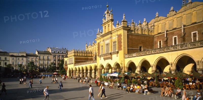 POLAND, Krakow, Rynek Glowny or Grand Square and the sixteenth century Renaissance Cloth Hall lined with busy cafes.