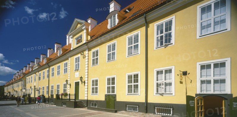 LATVIA,  , Riga, Swedish Gate. Row of bright yellow terraced houses