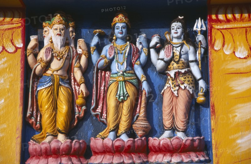 INDIA, Orissa, Gopalpur on Sea, Detail of brightly coloured temple statues of the Hindu Gods Vishnu and Siva