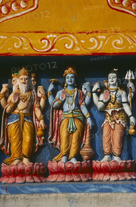 INDIA, Orissa, Gopalpur on Sea, Detail of colourful temple carvings depicting Hindu Gods