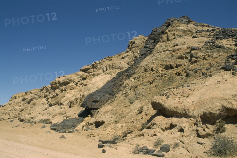 NAMIBIA, Dolerite Dyke, Molten laver ridge through hard rock with unequal weathering