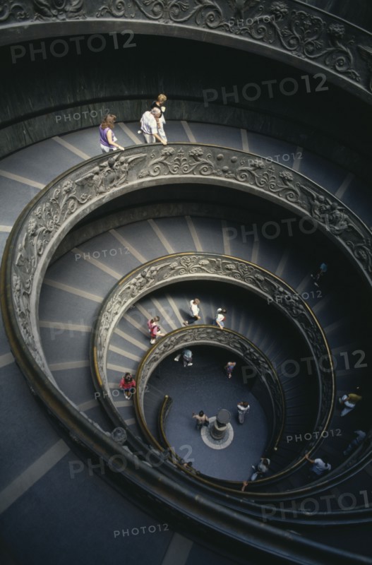 ITALY, Rome  , Vatican City, The spiral staircase in the Vatican Museum with tourists descending the stairs
