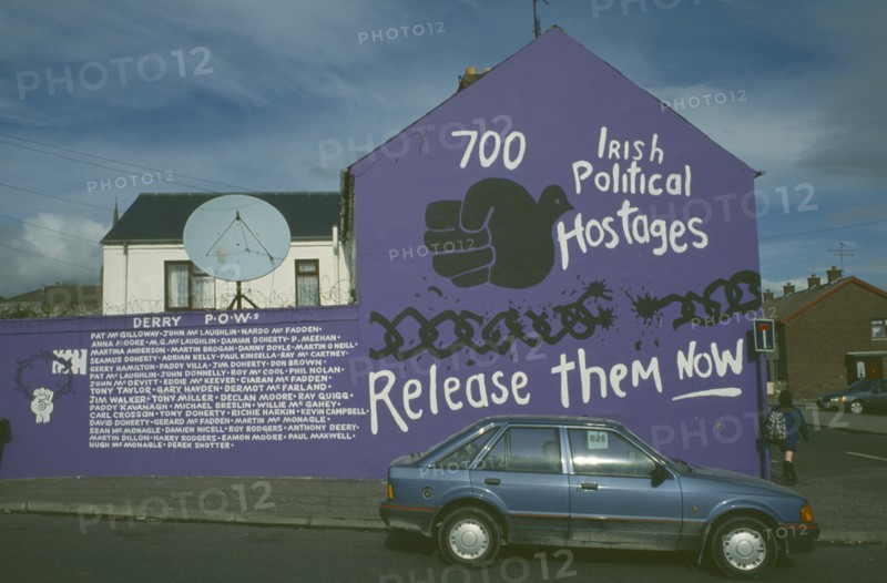 IRELAND,  North  , Derry, Mural listing the names of Irish Political Hostages in the Bogside area.