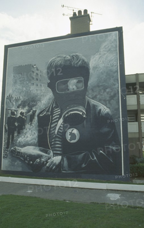 IRELAND,  North , Derry, Nationalist mural depicting a boy wearing a Gas Mask on the Bogside.
