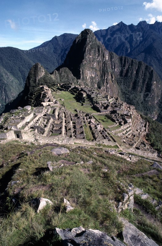PERU, Cusco, Machu Picchu, General view over the Inca ruins set in rocky mountain landscape