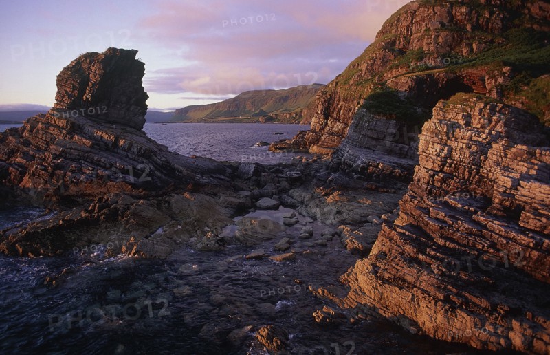 SCOTLAND, Isle Of Mull, Sea stack in evening light