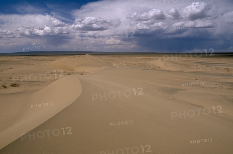 MONGOLIA, South Gobi , Vast expanse of desert sand dunes and cloudscape.