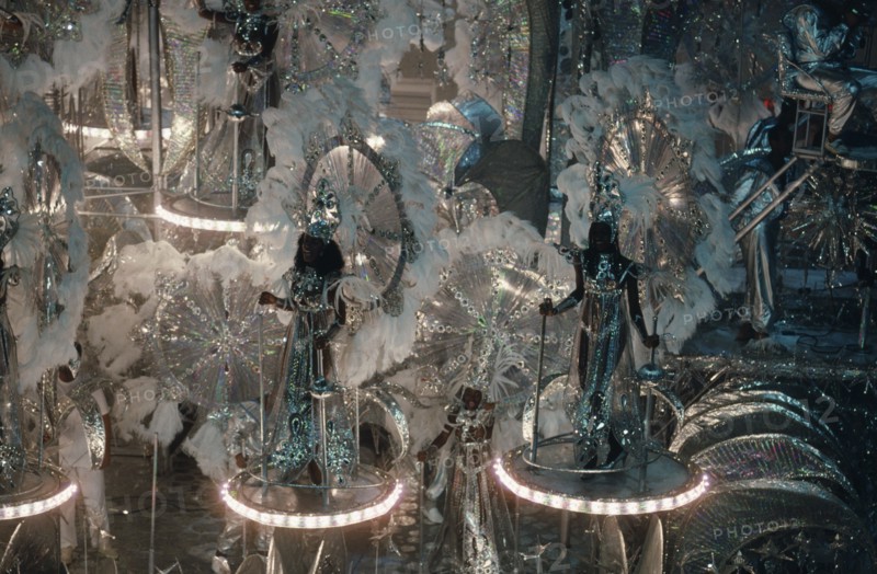 BRAZIL, Rio de Janeiro, Carnival float with dancers wearing glittering silver costumes