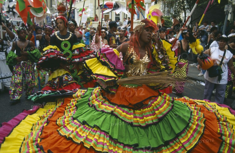 ENGLAND, London, Notting Hill Carnival, Dancers in costume during parade.