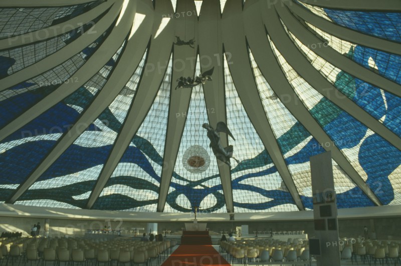 BRAZIL, Federal District, Brasilia, Cathedral interior with patterned glass roof and statues suspended from the ceiling