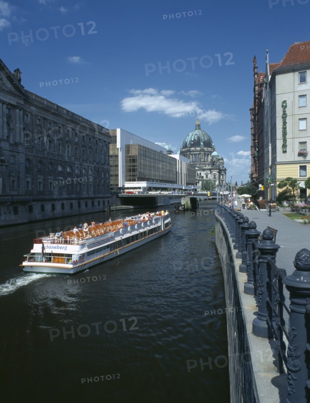 GERMANY, Berlin, View of boat travelling down the river Spree toward the Parliament building and Berlin Cathedral