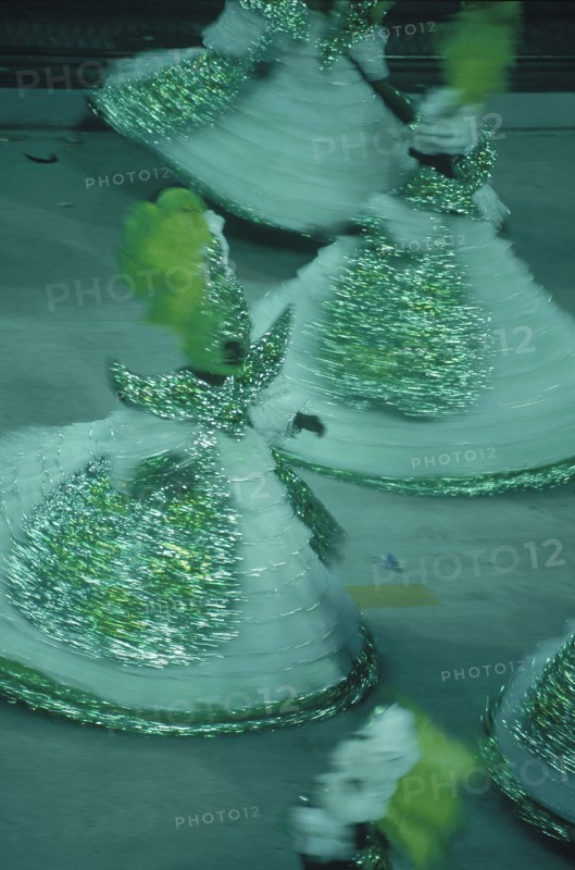 BRAZIL, Rio de Janeiro, Carnival procession with people in green gold and white costumes