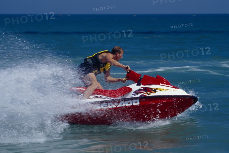 20001991 SPORT Water Sports Jet Ski Person on a red jet ski in action