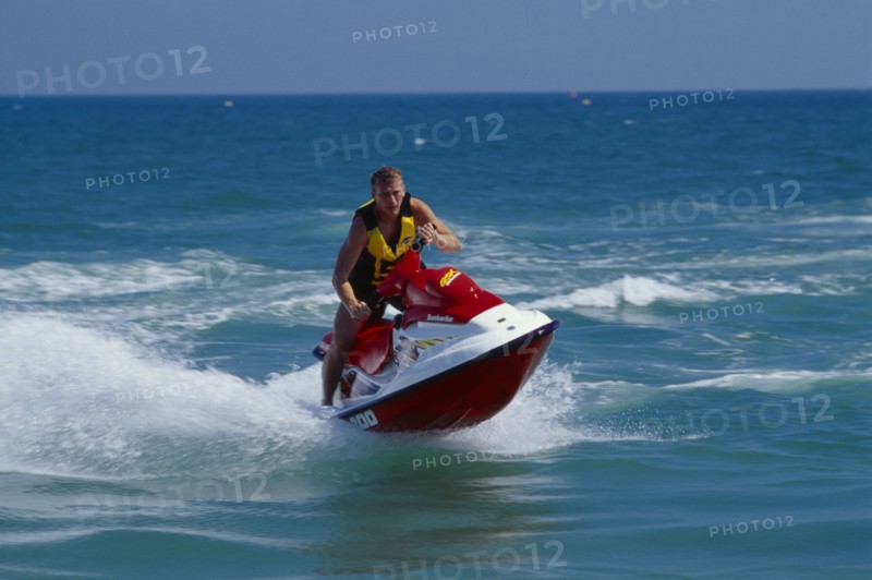 20001992 SPORT Water Sports Jet Ski Person on a red jet ski in action