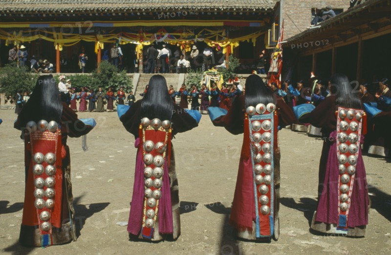 CHINA, Guizhou, Tongren , Tibetan Festival. Girls dancing at Monastery