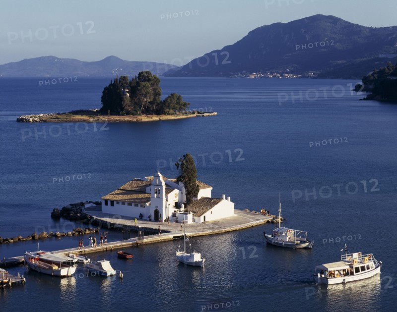 GREECE, Ionian Islands, Corfu, "Mouse Island, view over white church on an island in a lake"