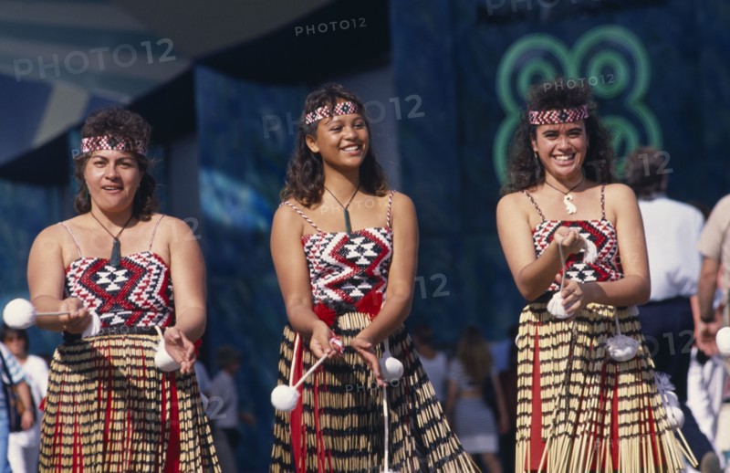 NEW ZEALAND, People, Maori , Maori girls doing Poi dance wearing grass skirts