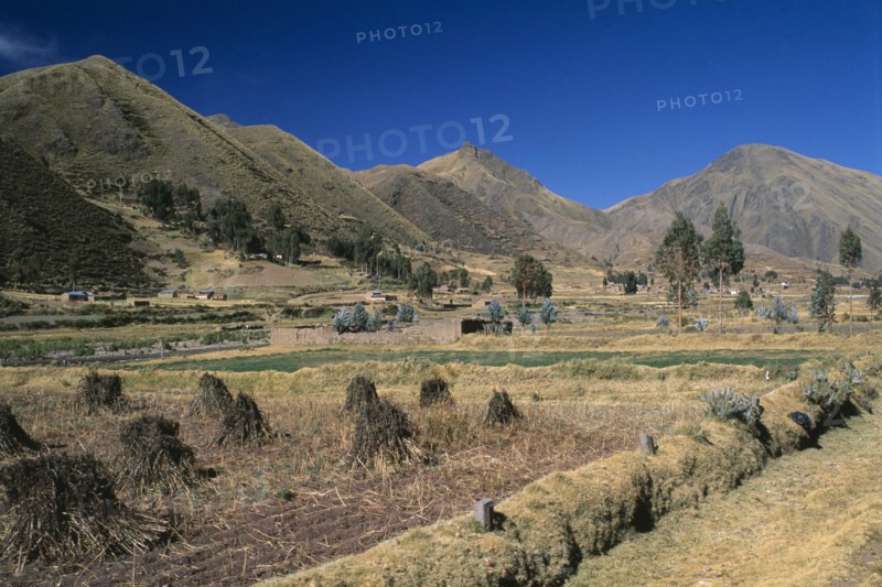PERU, Puno Administrative Department, La Raya, "View from the train on the altiplano.  Agricultural land in the foreground, mountains beyond.  "