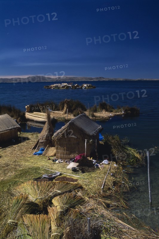 PERU, Puno, Lake Titicaca, Reed houses on floating islands built by the Uros people.