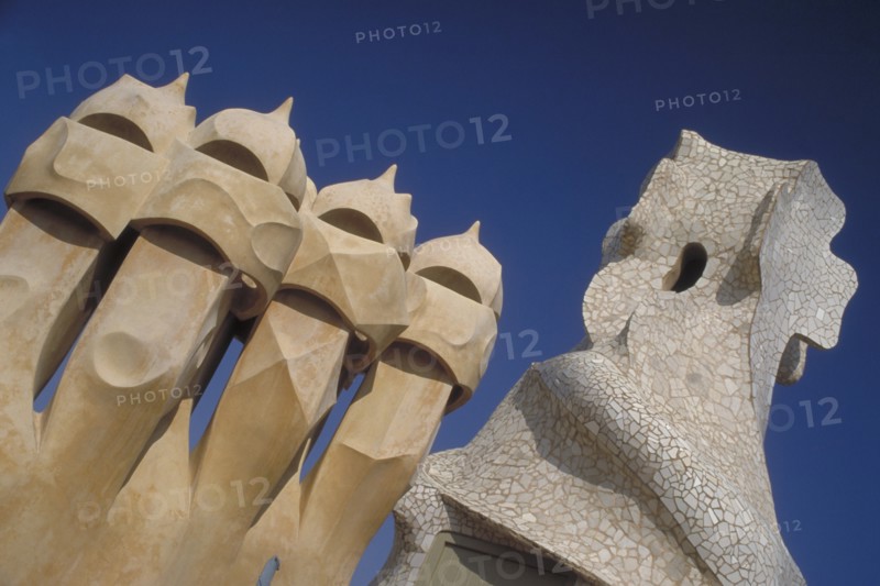 SPAIN, Catalonia, Barcelona, La Pedrera apartments designed by Gaudi with angled view of chimney pots.