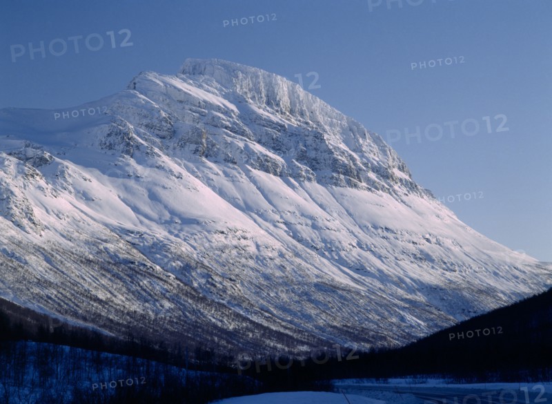 NORWAY, Troms, Lavangsdalen, Snow covered mountainside.