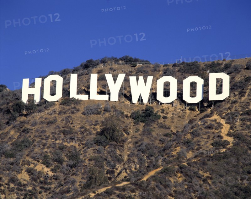 USA, California, Los Angeles, The Hollywood Sign on hillside with blue sky behind