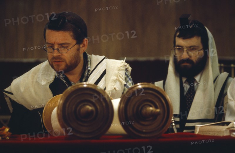 SOCIETY, Religion, Judaism, Two Rabbis saying Mincka prayers in front of Torah scrolls inside Catford Synagogue