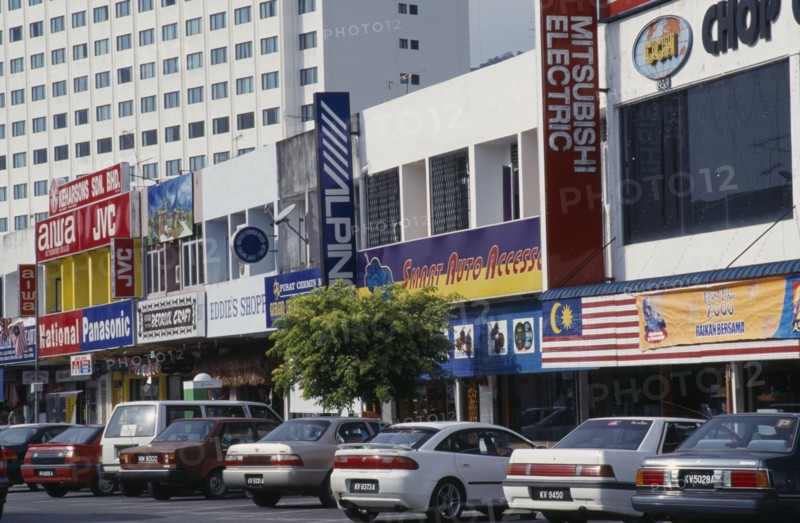 MALAYSIA, Kedah, Langkawi, Kuah old town electrical goods shops with cars parked in front