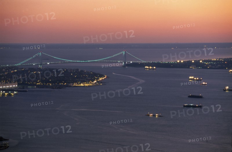 USA, New York State, New York, Aerial view of the sea approaches to the city and the Verrazano Narrows Bridge at night.