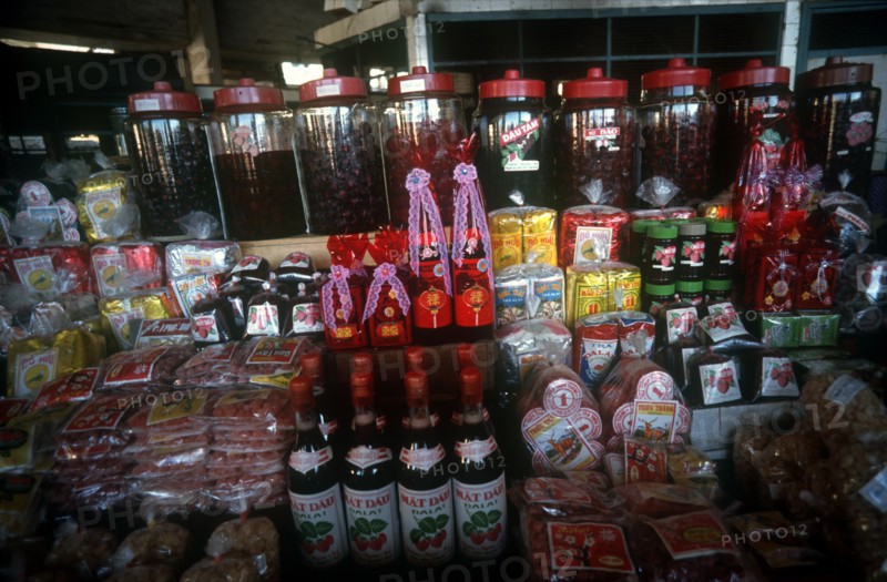 VIETNAM, Dalat, Market stall display of various products made from strawberries.