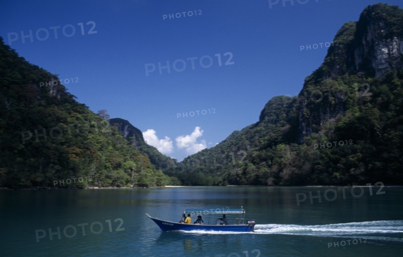 MALAYSIA, Kedah, Langkawi, Pulau Dayang Bunting island with a traditional covered boat used for transport between the islands