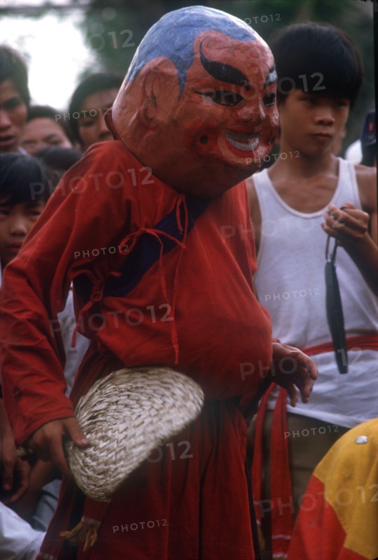 VIETNAM, Ho Chi Minh City , "Dancer in carnival head at Ton San village, celebrating Tet Nguyen Dan, the Vietnamese New Year."