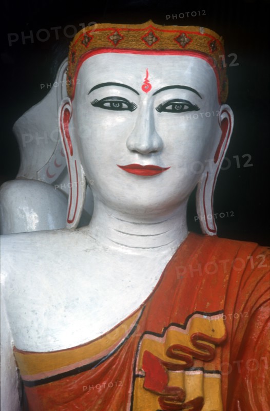 MYANMAR, Yangon, "Shwedagon Pagoda.  White faced Buddha figure, detail of head and shoulders."
