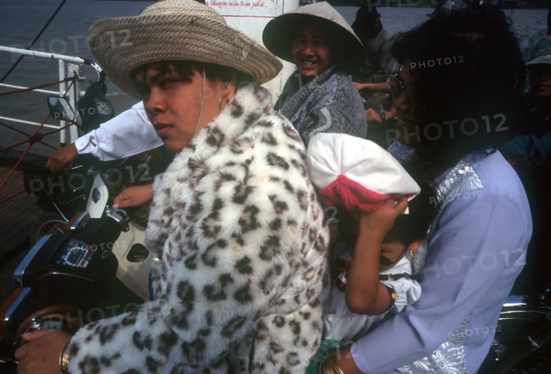 VIETNAM, South, Ben Tre, Passengers sitting on motorbikes on a Mekong  ferry