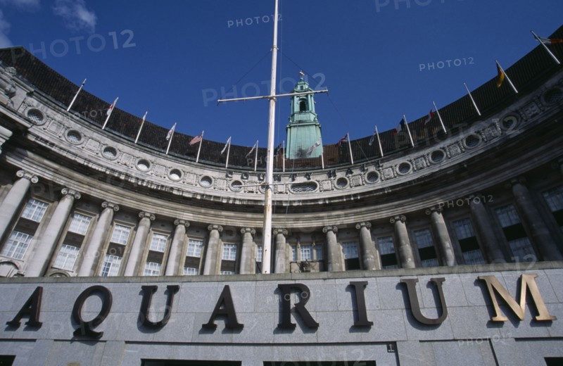 ENGLAND, London, Looking up at curved Aquarium exterior and name sign on the County Hall building