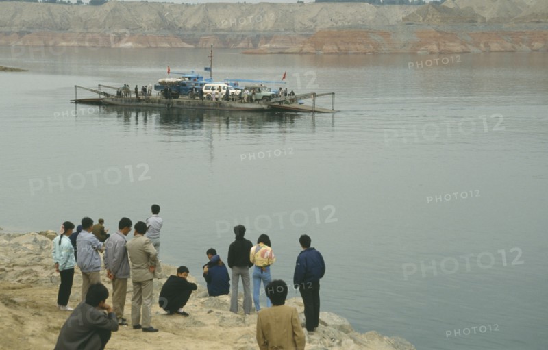 CHINA, Gansu Province, Yellow River, Linjiaxia Reservoir  with people waiting for the ferry