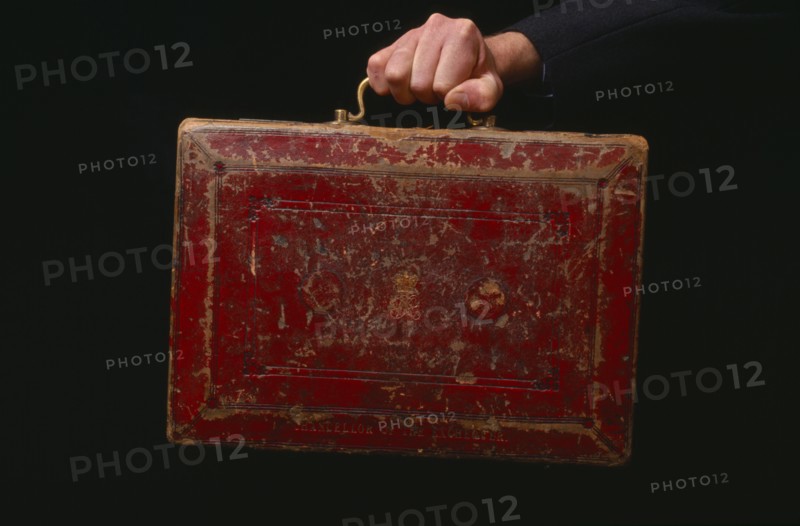 INDUSTRY, Business, Finance, Hand holding the old red leather Budget briefcase