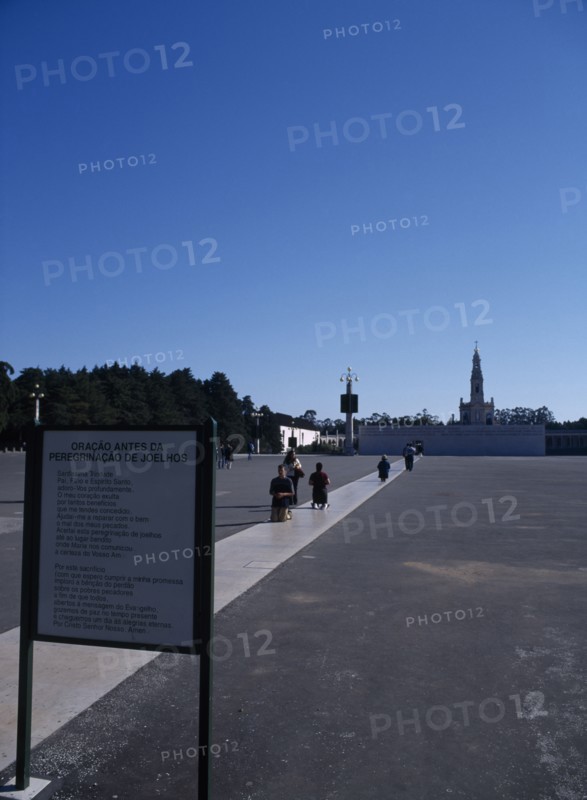 PORTUGAL, Beira Litoral, Fatima, Pilgrims approaching shrine on their knees whilst praying
