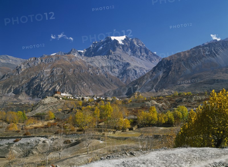 NEPAL, Annapurna Region, Jharkot, View over Jhong Khola Valley and the Thorung La pass to distant fortress town and Yakawa Kang mountain.
