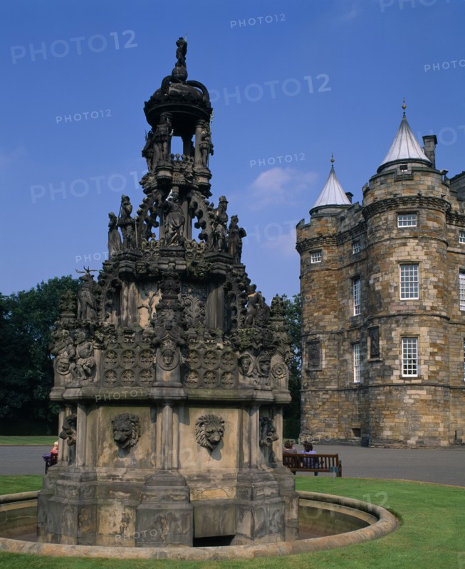 SCOTLAND, Lothian, Edinburgh, "Holyrood Palace, part view of western exterior with ornate carved, stone fountain in the foreground."