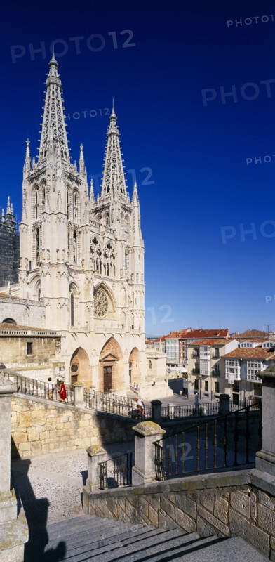 SPAIN, Castilla Y Leon , Burgos Province, Cathedral.  View from flight of stone steps in the foreground towards gothic facade and twin spires.