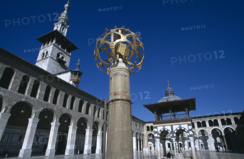 SYRIA, South, Damascus, "The Umayyad Mosque.  Lantern holder with ablutions fountain, Minaret of the Bride and arcade in the background."