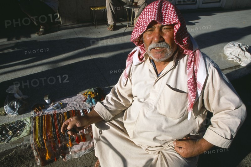SYRIA, Central, Dayr-az-Zawr, Prayer bead vendor on roadside.